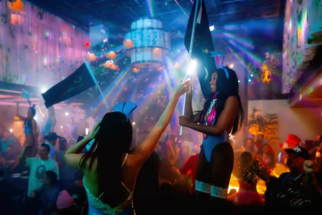 LAVO Party Brunch Las Vegas — Guests celebrating beneath colorful lights