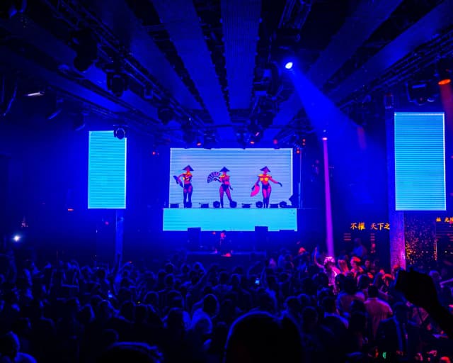 TAO Nightclub Las Vegas — Stage dancers above the crowd