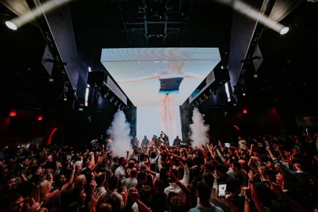 Marquee Nightclub Las Vegas — DJ performing above the crowd Marquee Nightclub Las Vegas — DJ performing above the crowd